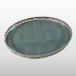 An early 20th century shagreen and silver plated tray, of oval shape, with a pierced gallery,