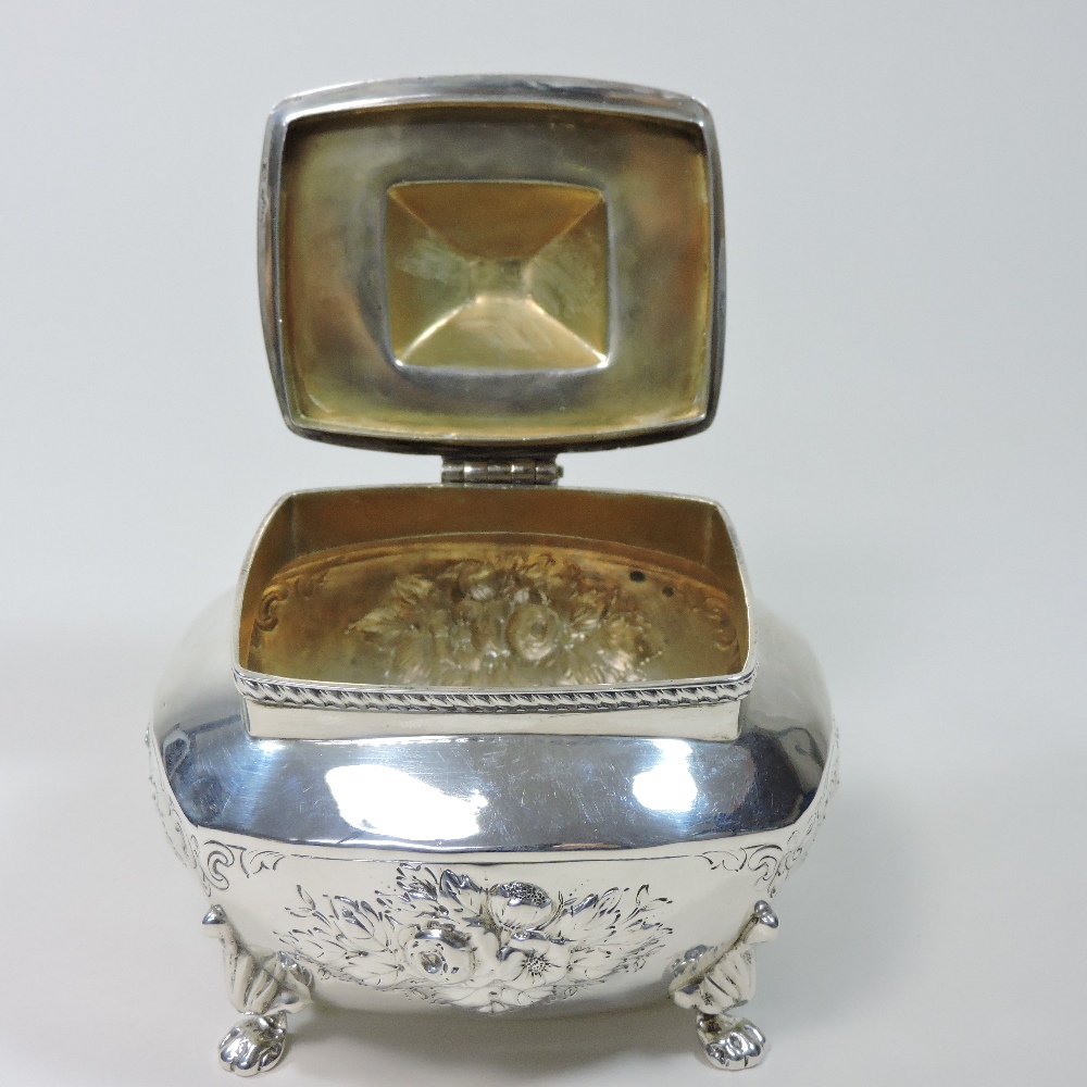 An early 20th century silver tea caddy, relief decorated with flowers, on paw feet, - Image 6 of 9