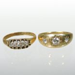 An 18 carat gold three stone diamond gypsy ring,