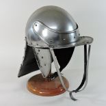 A reproduction suit of armour helmet,