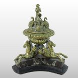An ornate 19th century French brass inkwell, the removable lid,