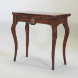 A 19th century walnut and brass inlaid folding card table, with gilt metal mounts, on cabriole legs,
