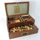 A 19th century mahogany cased games compendium, the fitted interior to include a wooden chess set,