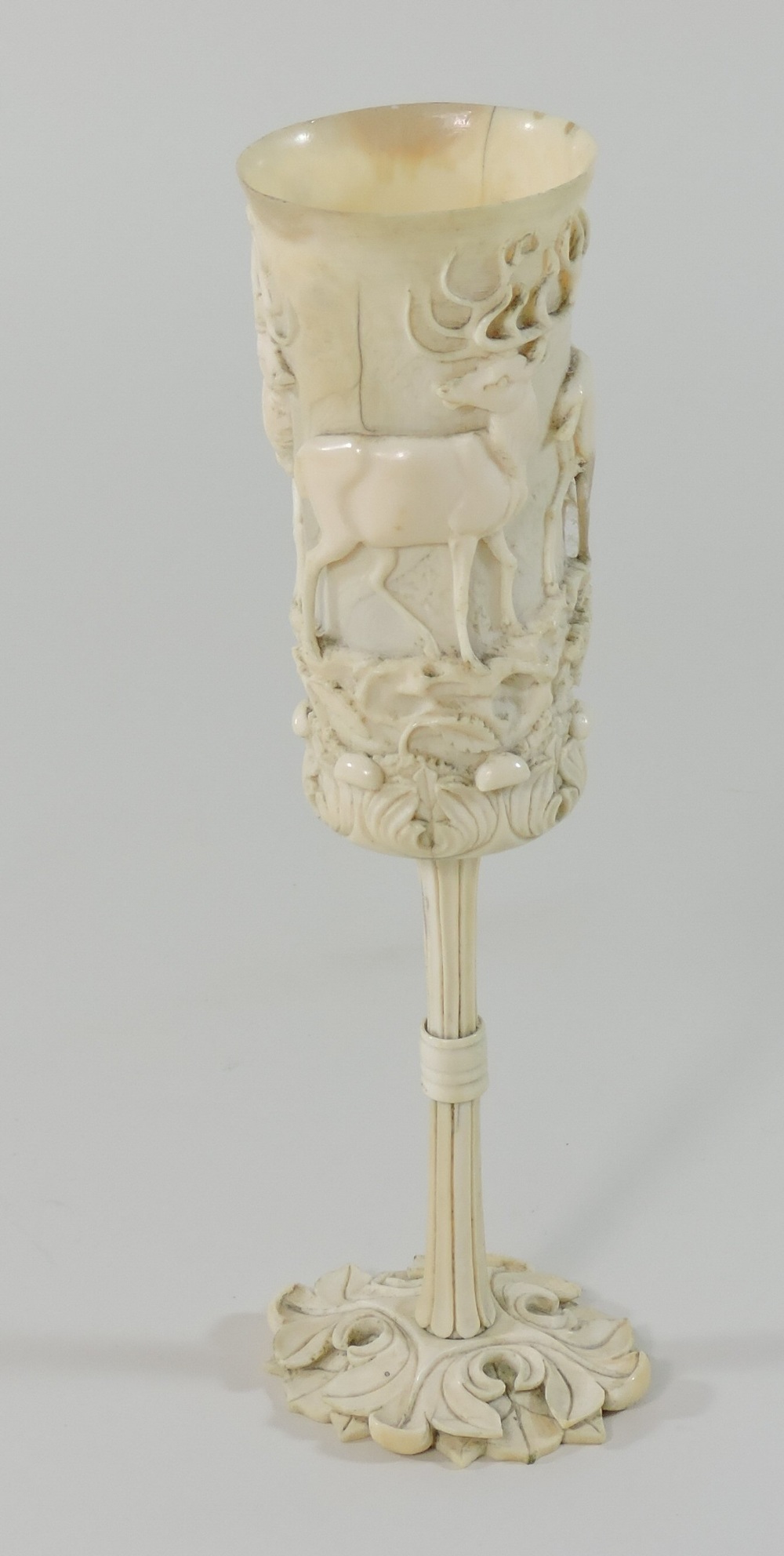 A 19th century German carved and turned ivory hunting cup, of slender form, - Image 4 of 9