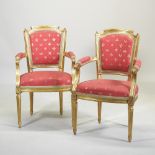 A set of eight French style gilt painted and red upholstered armchairs,