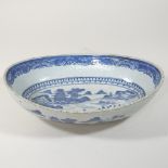 A 19th century Chinese porcelain blue and white dish, decorated with a landscape,