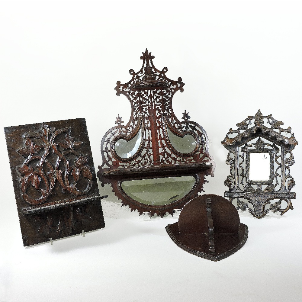 An Edwardian mahogany fret carved mirrored wall bracket, 60cm high,