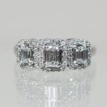 An unmarked 18 carat three stone diamond ring,