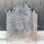 A large cast iron fire back,