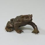 A modern oriental bronzed model of a frog,