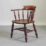 A Victorian oak captain's chair,