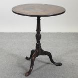 A 19th century mahogany occasional table, with a circular top, on a tripod base,