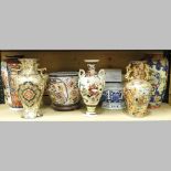 A shelf of oriental china, to include a pair of Japanese vases,