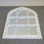 A white painted Gothic style wall mirror,