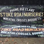 A Stoke Road nurseries painted wooden advertising sign, in two sections, 84 x 198cm,