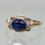 A 14 carat gold sapphire and diamond ring,