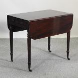 A Victorian mahogany pembroke table, containing a single drawer,