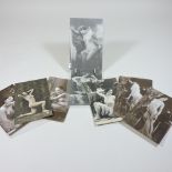 A collection of nine early 20th century French erotic postcards,