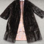 A vintage ladies full length fur coat