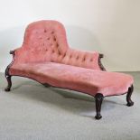 A Victorian pink upholstered chaise longue,