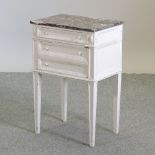 A white painted French style bedside cabinet, with a rouge marble top,