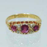 A 18 carat gold ruby and diamond ring,