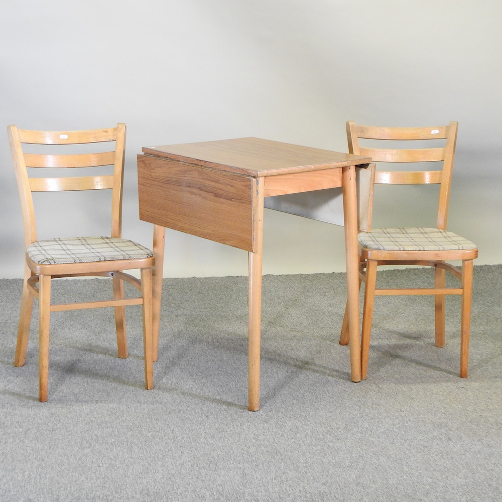 A vintage melamine drop leaf kitchen table, 92 x 60cm overall,