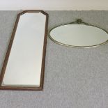 An oak framed wall mirror, 128 x 44cm,