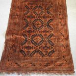 A Turkish rug, on a red ground,