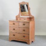 An Edwardian satin walnut dressing chest,