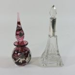 An early 20th century silver mounted glass scent bottle, 17cm high,