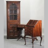 A carved oak corner cabinet, 183cm high,