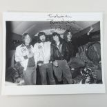 A 1970's Led Zeppelin press photograph, signed in pen by each of the band members,