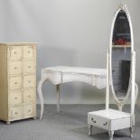 A white painted French style dressing table, 134cm, together with a matching cheval mirror,