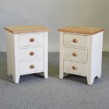 A pair of white painted bedside cabinets,