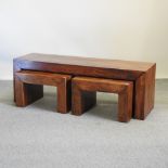 A nest of three contemporary wooden occasional tables,