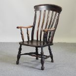 A Victorian oak splat back armchair,