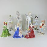 A large KPM bisque porcelain figure group, 39cm high, together with various others,