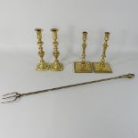 A pair of 18th century brass candlesticks, 27cm high,