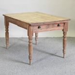 An antique pine dining table,