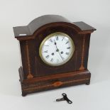 An Edwardian mahogany and inlaid mantel clock,