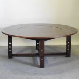 A contemporary Mackintosh style circular hardwood dining table, with an inset lazy susan,