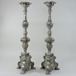 A pair of large silver plated Rococo style candlesticks,