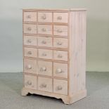 A French style pine chest of drawers,