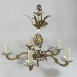 A six branch brass and ceramic chandelier, decorated with porcelain flowers,