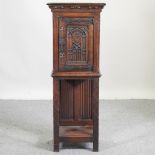 A 19th century carved oak cabinet on stand,