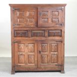 A 19th century continental walnut cabinet, enclosed by two pairs of panelled doors,