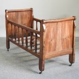 A 19th century French walnut cot,