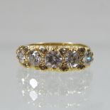 An 18 carat gold diamond half hoop eternity ring, set with a single row of graduated stones,
