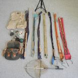 A collection of fishing rods, to include a Hardy #10 salmon fly,